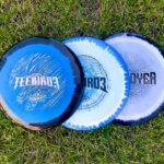 Three disc golf discs that you need photographed on the grass