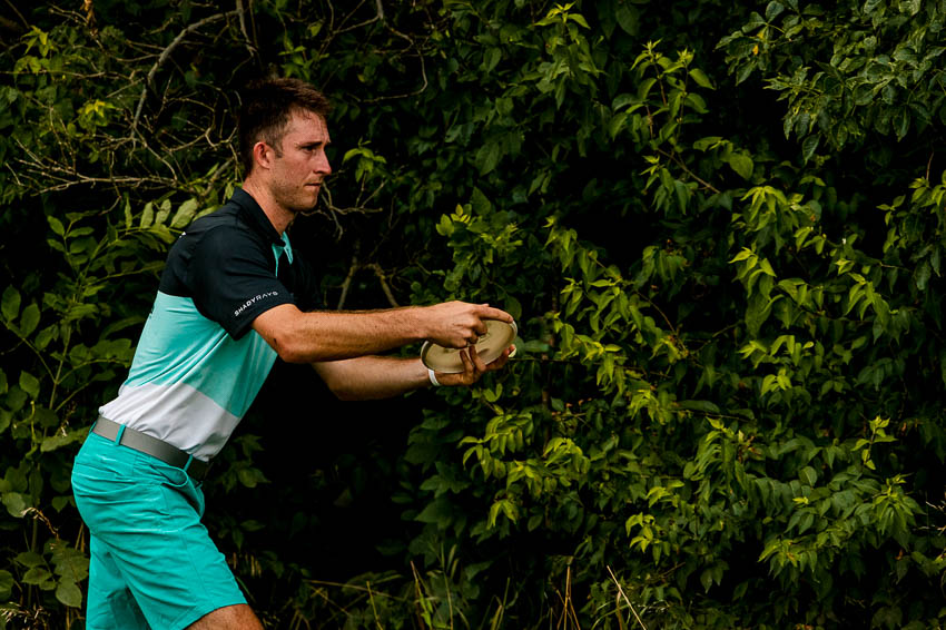Ricky Wysocki, a professional disc golfer about to throw his putter.
