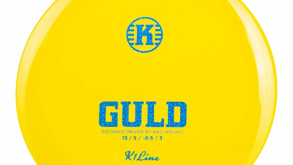 A Yellow Kastaplast K1 Guld Distance Driver Disc with Blue Sparkles Stamp