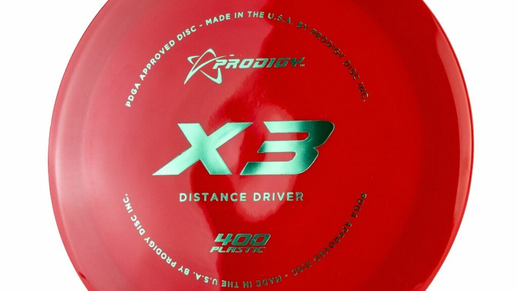 A red/maroon Prodigy X3 red disc with Green metallic stamp
